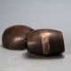 Brass plates of constant positive curvature